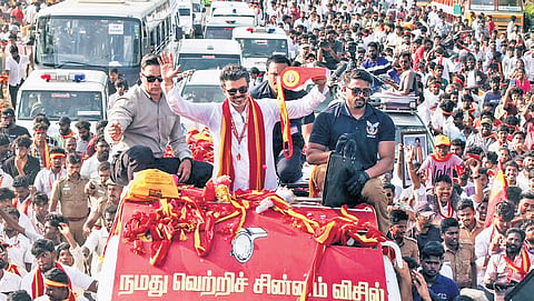 Actor-politician Vijay waving at supporters during a rally in Kanniyakumari.