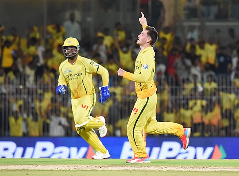 CSK's Noor Ahmad (L) celebrates a KKR wicket