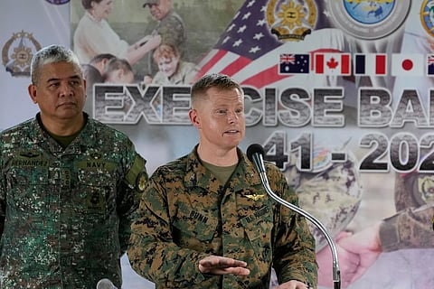 US Col. Robert Bunn, right, speaks beside Philippine Navy Col. Dennis Hernandez during a press conference for the upcoming joint military exercise dubbed "Balikatan"  or "Shoulder to Shoulder" at Camp Aguinaldo military headquarters on Tuesday, April 14, 2026, in Quezon city, Philippines.
