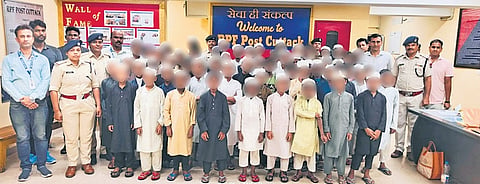 RPF personnel along with the 59 boys rescued from Cuttack railway station | Express