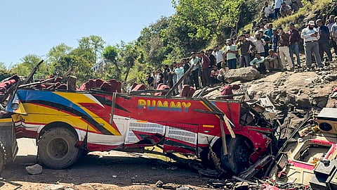 Wrecked remains of a passenger bus after it rolled down a hill, in Jammu and Kashmir's Udhampur district, Monday, April 20, 2026. 