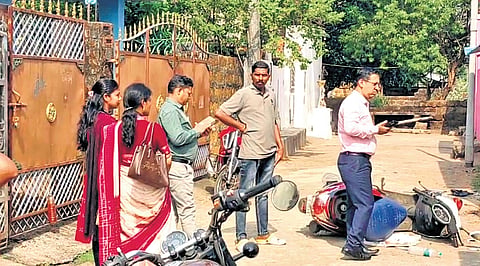 The teachers stand outside the accused’s house at Mahima Nagar 