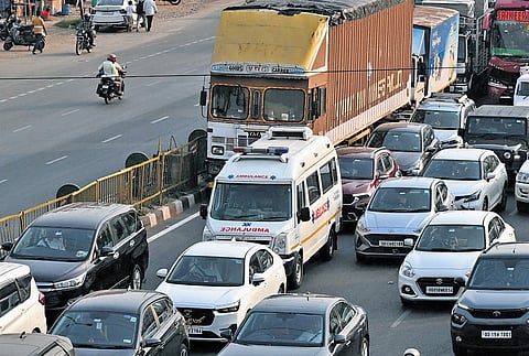 An ambulance stuck on NH-16 at Palasuni following a massive traffic jam after a truck caught fire on Palasuni overbridge in Bhubaneswar.
