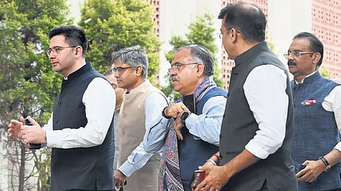 AAP Rajya Sabha MPs Raghav Chadha, Sandeep Pathak and others arrive to meet BJP president Nitin Nabin, before their merger in New Delhi on Friday.
