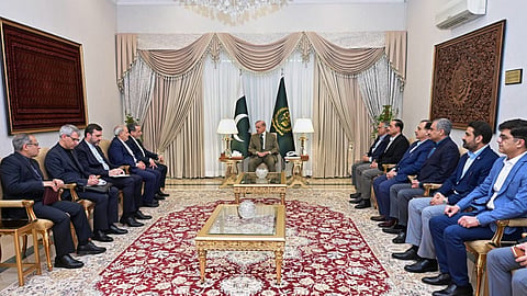 This photo released by the Pakistan Prime Minister's Office shows Iran's Foreign Minister Abbas Araghchi, fifth left, meeting with Prime Minister Shehbaz Sharif, centre.