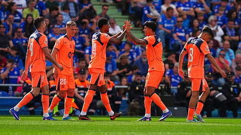 Barcelona's Marcus Rashford, third from left, is congratulated after scoring his side's 2nd goal during the Spanish La Liga soccer match between Getafe and Barcelona in Getafe, Spain, Saturday, April 25, 2026
