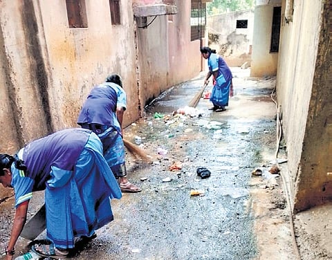 Sanitation staff clean slum areas under Vijayawada Municipal Corproration