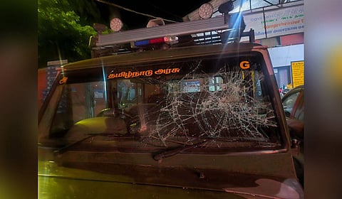 Protesters damaged the windshield of a forest department vehicle at O-Valley in Gudalur forest division on Saturday night. 