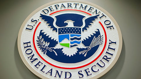 FILE - The Department of Homeland Security logo during a news conference in Washington, Feb. 25, 2015