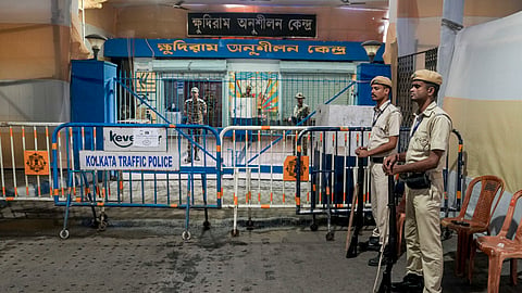 Security personnel keep vigil outside a strong room before the declaration of results in the West Bengal Assembly elections, in Kolkata, Thursday, April 30, 2026.