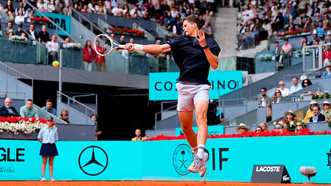 Alexander Blockx of Belgium returns the ball to Casper Ruud of Norway during the quarterfinal match at the Madrid Open tennis tournament in Madrid, Thursday, April 30, 2026. 