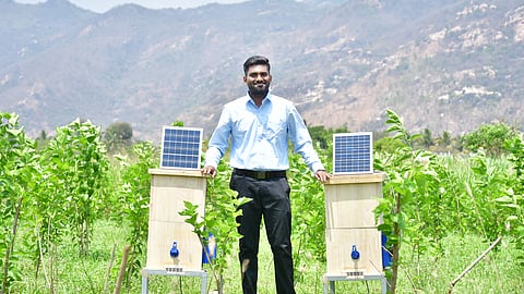 Rohit N next to the autonomous, AI-based beehive he designed from funding received from a scheme floated by the Ministry of Science.