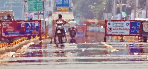 Mirage effect shimmers on sunlit BRTS Road in Vijayawada.
