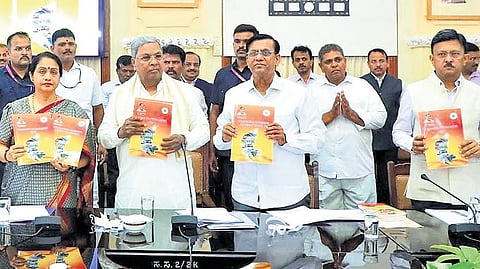 CM Siddaramaiah releases a handbook comprising 15 success stories of the state’s progress, at Vidhana Soudha in Bengaluru on Saturday.