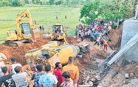The overturned concrete mixer truck at the construction site near Tilisingh village