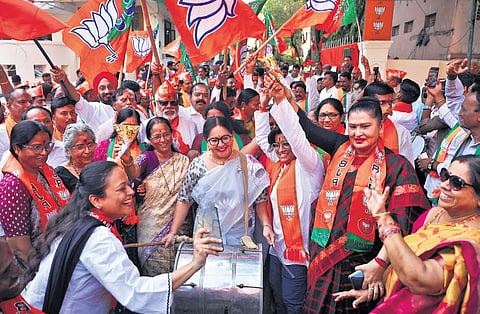 BJP workers celebrate their party’s victory in Assam and West Bengal Assembly elections, at the BJP state office in Nampally in Hyderabad.