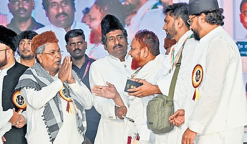 Chief Minister Siddaramaiah greets Haj pilgrims after launching a Haj 2026 flight in Bengaluru on Monday.