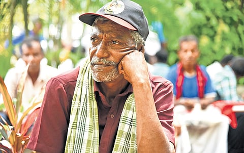 A distraught DMK supporter after the announcement of the election results.