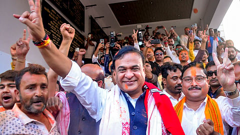 Assam Chief Minister Himanta Biswa Sarma with state BJP president Dilip Saikia shows victory sign during celebrations amid vote tabulation as the party leads in the Assembly elections, at the party headquarters, in Guwahati, Assam, Monday, May 4, 2026. 