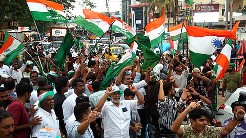 Supporters of the United Democratic Front (UDF) celebrate their victory in the Kerala Legislative Assembly Elections at Kalamassery on Monday, with jubilant scenes of cheering, slogans, and waving party flags.|Express Photo by TP Sooraj