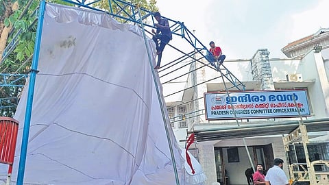 Workers set up a pavilion at the KPCC headquarters, Indira Bhavan, in Thiruvananthapuram, on the eve of vote counting.
