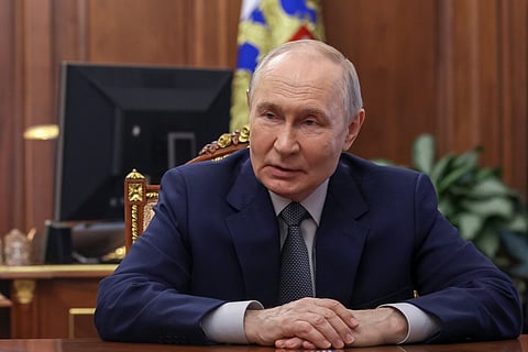Russian President Vladimir Putin listens to Head of the Republic of Mordovia Artyom Zdunov at the Kremlin in Moscow, Monday, May 4, 2026. 