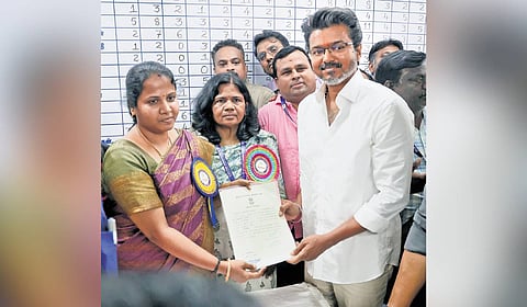 TVK chief Vijay receives his winning certificate in Chennai on Monday.