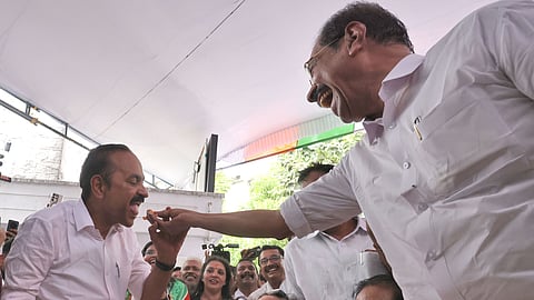 KPCC president Sunny Joseph shares a piece of cake to Opposition Leader VD Satheesan during the Assembly election victory celebrations at Indira Bhavan in Thiruvananthapuram on Monday. 