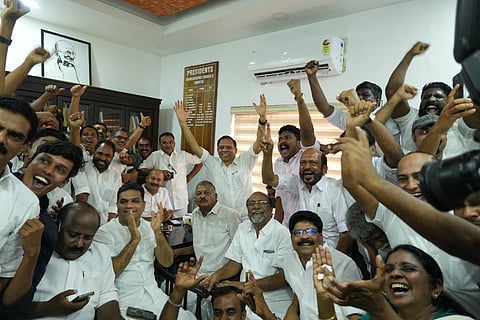Congress party members watching the result being published in DCC office on Monday.