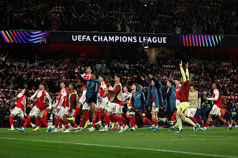 Arsenal players celebrate winning the UEFA Champions League second-leg semi-final football match between Arsenal and Atletico Madrid at the Emirates Stadium in north London on May 5, 2026. 