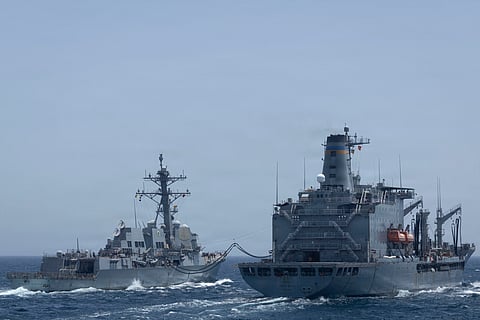 This US Navy handout photograph released on May 2, 2026 by US Central Command Public Affairs shows Arleigh Burke-class guided-missile USS Michael Murphy (DDG 112) conducting a replenishment-at-sea with fleet replenishment oiler USNS Henry J. Kaiser (T-AO-187) on April 27, 2026.