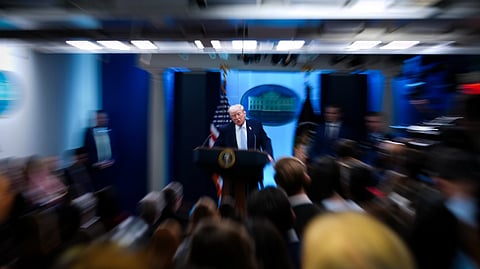 President Donald Trump, accompanied by Defense Secretary Pete Hegseth and Chairman of the Joint Chiefs of Staff Gen. Dan Caine, speaks with reporters in the James Brady Press Briefing Room at the White House, Monday, April 6, 2026, in Washington.