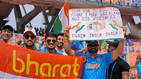 Indian cricket fans cheer holding banners and posters as they arrive at the stadium hours before the start of the ICC Men's Cricket World Cup final match between India and Australia in Ahmedabad, India, Sunday, Nov.19, 2023.