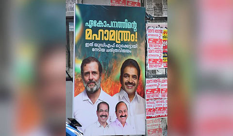 
A poster put up by UDF supporters at the Palarivattom bus stop in Kochi reads, 'The great mantra of unity achieved by the UDF standing together.'