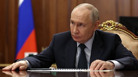 Russian President Vladimir Putin listens to Rostec State Corporation CEO Sergei Chemezov during their meeting at the Kremlin in Moscow, Thursday, May 7, 2026. 