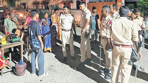 Police personnel interact with the public during foot patrolling in Sambalpur.