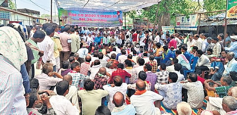 Farmers staging protest at Koksara in Kalahandi district on Friday.