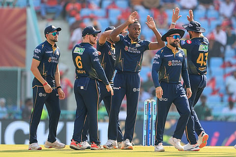 Kagiso Rabada celebrates a wicket with his teammates in IPL