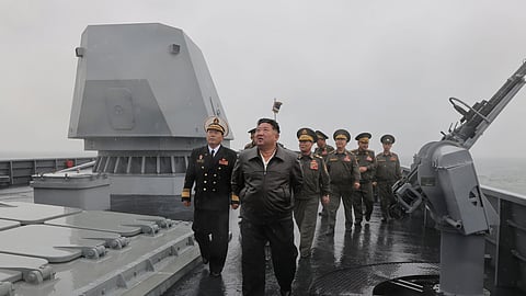 In this photo provided by the North Korean government, its leader Kim Jong Un, center, visits the destroyer Choe Hyon to review its maneuverability off North Korea's west coast, Thursday, May 7, 2026.