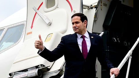 US Secretary of State Marco Rubio waves as he boards a US government aircraft after concluding his two-day visit to Italy and the Vatican, at Ciampino airport in Rome, Friday, May 8, 2026.