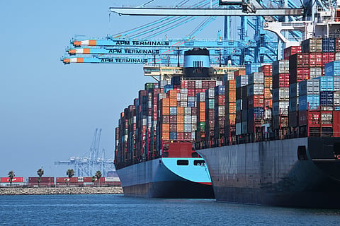 Container ships are docked at the APM Terminal at the Port of Los Angeles, California, on July 31, 2025.