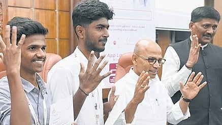 Skill Development Minister Dr Sharan Prakash R Patil distributes offer letters to specially-abled candidates at a job fair at Vikasa Soudha in Bengaluru on Thursday.