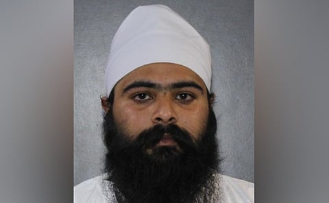 The accused, Jaskaran Saroye, was arrested by the Surrey Police Service Extortion Response Team after officers executed a search warrant on April 13.