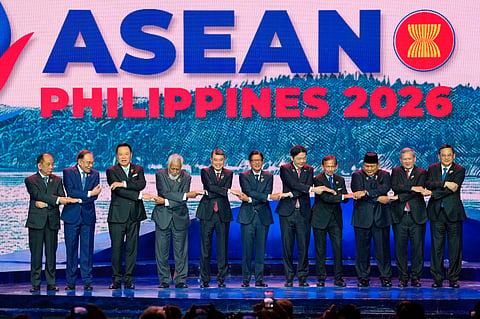 Southeast Asian leaders hold hands for a group photo during the opening ceremony of the 48th ASEAN summit and Related Meeting in Cebu, Philippines on.