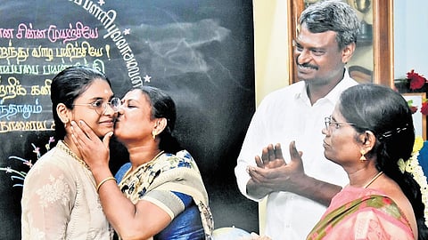 Maithili celebrates her success after the Class 12 results were declared on Friday, at the Chennai Corporation Girls Higher Secondary School in Pulla Avenue.