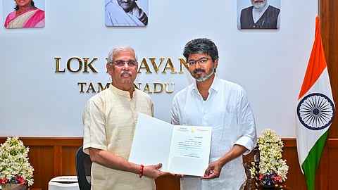  Tamil Nadu Governor Rajendra Vishwanath Arlekar hands over the letter of appointment to TVK chief C Joseph Vijay as the new state Chief Minister, at the Lok Bhavan, in Chennai, Saturday, May 9, 2026.