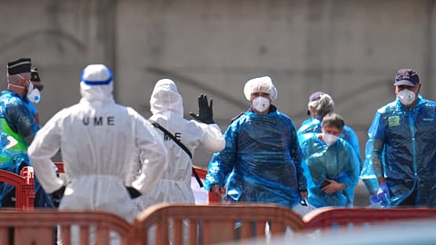 Passengers are disembarked from the hantavirus-stricken cruise ship MV Hondius at the port of Granadilla in Tenerife, Canary Islands, Spain, Sunday, May 10, 2026.