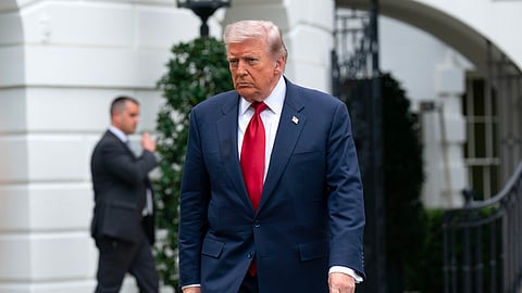 US President Donald Trump walks to speak with reporters before boarding Marine One on the South Lawn of the White House, Friday, May 8, 2026, in Washington. 
