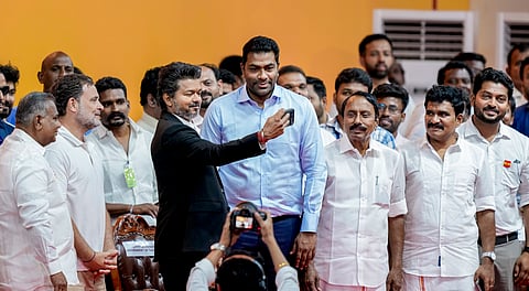 Newly-elected Tamil Nadu Chief Minister and Tamilaga Vettri Kazhagam (TVK) chief C Joseph Vijay takes a selfie with Congress MP and Lok Sabha LoP Rahul Gandhi and his party cabinet members during the TVK cabinet's swearing-in ceremony, at Jawaharlal Nehru Stadium, in Chennai, Sunday, May 10, 2026.