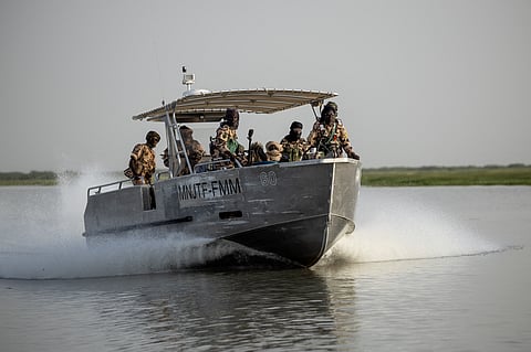 Chadian soldiers patrol on Lake Chad.